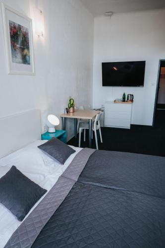 Postel nebo postele na pokoji v ubytování Hotel Centrum