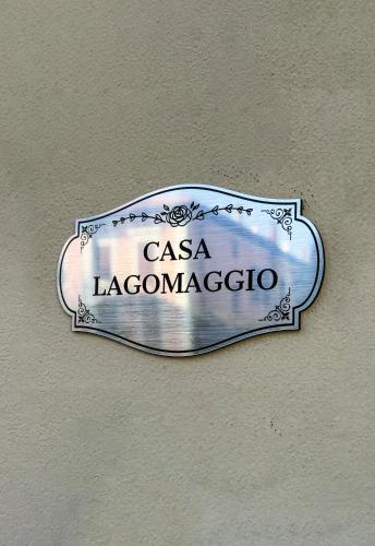 a sign on the side of a building at Casa Lagomaggio in Rimini