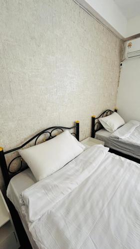 Coco House Sukhumvit 1, BTS ploenchitにあるベッド