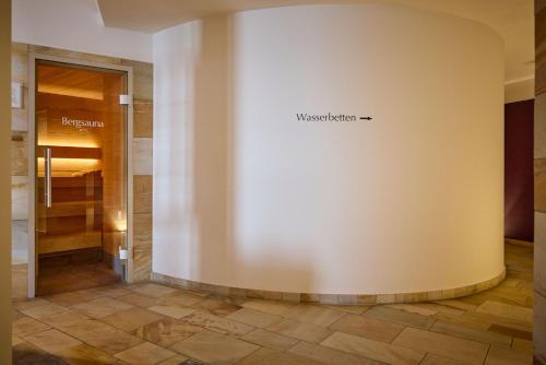 a hallway with a wall with the word installation on it at Wellness Hotel Stoos in Stoos