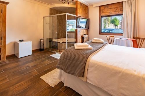 Postel nebo postele na pokoji v ubytování Hotel Ascona