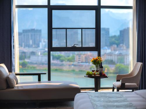 Vanbrugh Bay Hotel - Zhangjiajie Tianmen Mountainにあるベッド