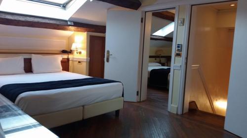Cama o camas de una habitación en Alloggi Arlecchino