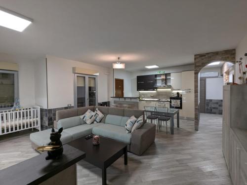 a living room with a couch and a table at La casa di Jo in Navacchio