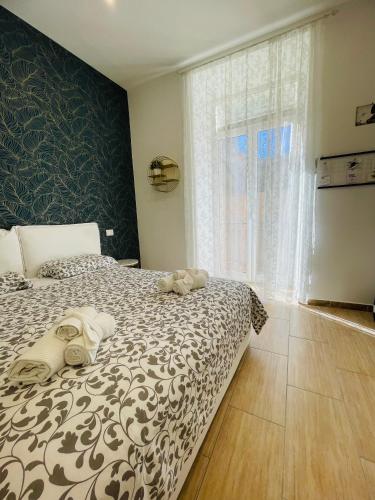 Postel nebo postele na pokoji v ubytování Scalinata Partenopea
