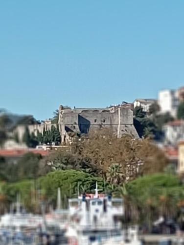 a building on top of a hill with boats at Al molo 21 in La Spezia