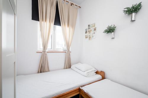 Posteľ alebo postele v izbe v ubytovaní Master Corner Apartment