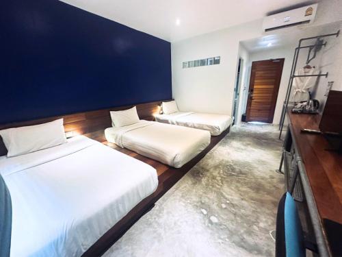 Ein Bett oder Betten in einem Zimmer der Unterkunft TATATA Koh Tao