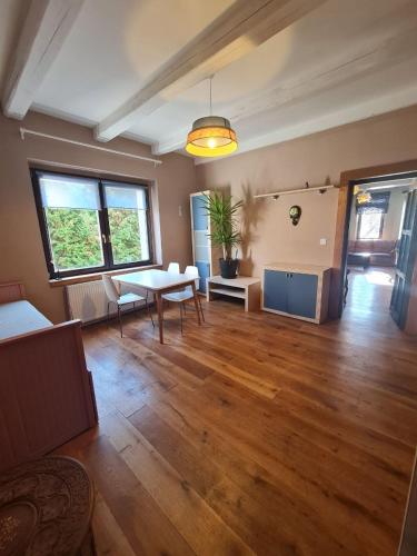 a large living room with a table and chairs at Guest Rooms in Private Home by Airport, Shared Bath, Non-Smoking, Contactless Check-in, No Staff, Quiet Stay, Short Stay in Kněžívka