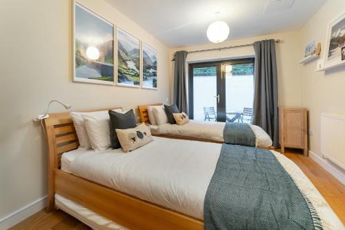 Кровать или кровати в номере 9 Blue Hill Park, Ambleside