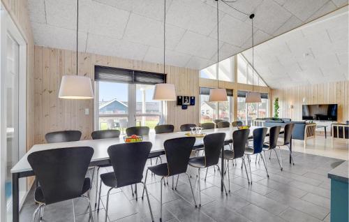 a large dining room with a long table and chairs at Awesome Home In Sydals With Kitchen in Høruphav