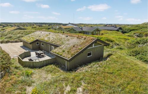 an overhead view of a house with a grass roof at Pet Friendly Home In Pandrup With Sauna in Blokhus