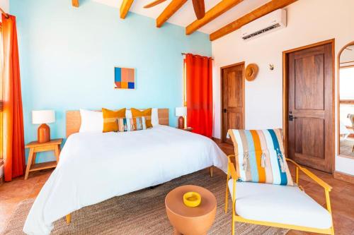 Ένα ή περισσότερα κρεβάτια σε δωμάτιο στο Beachfront Community - Villa 8 Guests