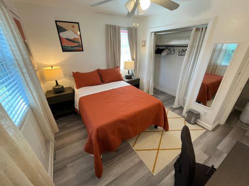 a bedroom with a bed and a large mirror at Horizon Haven in Jacksonville