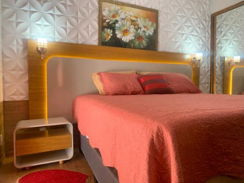 Una cama o camas en una habitación de Pousada Cascata dos Amores