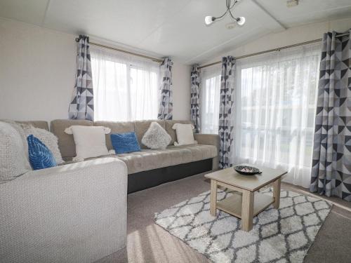 a living room with a couch and a table at 610 Caravan in Bognor Regis