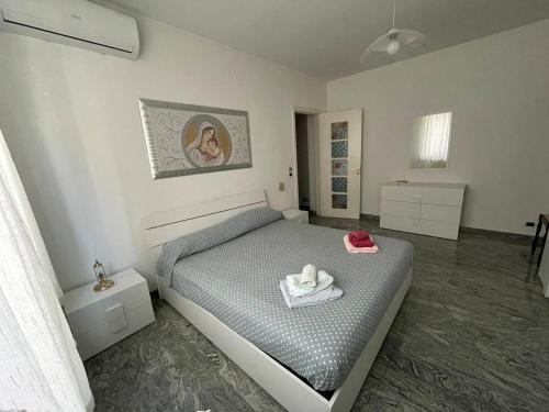 a bedroom with a bed with a towel on it at B&B Anna in Montescaglioso
