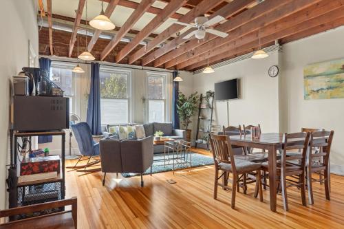 a dining room and living room with a table and chairs at Living on The Edge of Capitol Hill in Washington, D.C.