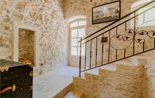 a staircase in a castle with a stone wall at 2 Bedroom Lovely Home In Blato in Blato