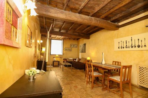 a living room with a table and a couch at Domus Antica Navona in Rome