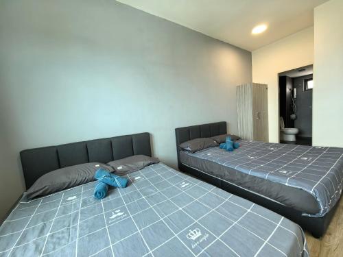 Ένα ή περισσότερα κρεβάτια σε δωμάτιο στο Platinum Suite Meritus by Moowin