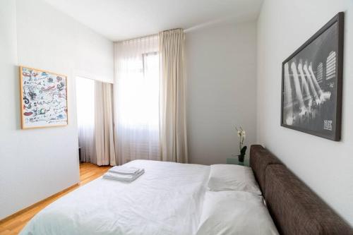 Ένα ή περισσότερα κρεβάτια σε δωμάτιο στο Charming 1BR flat near lake - FB1