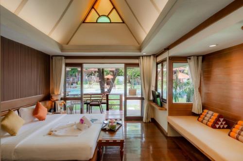 Postel nebo postele na pokoji v ubytování Baan Duangkaew Resort
