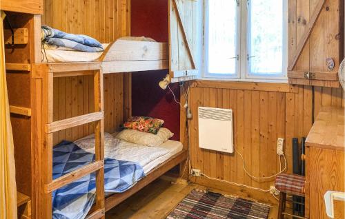 two bunk beds in a room with a window at 2 Bedroom Beautiful Home In Frombork in Frombork