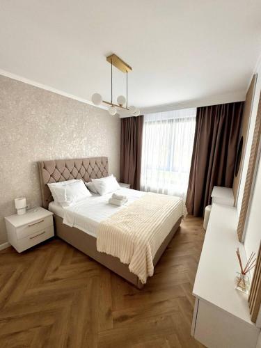 Postel nebo postele na pokoji v ubytování Lake View Luxury Apartament