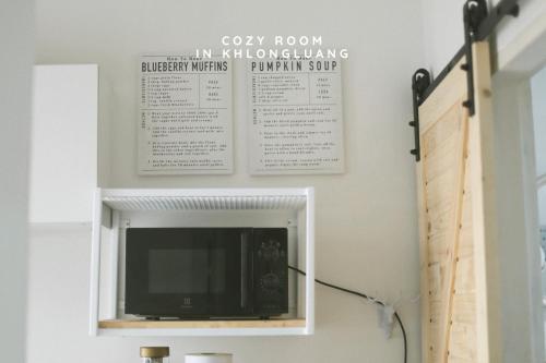 a tv in a niche in a wall at Cozy room in Khlongluang - Self Check-in in Khlong Luang