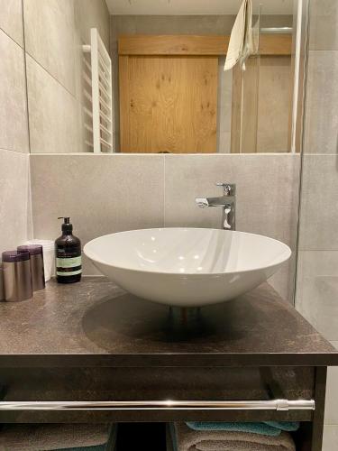 a white sink on a counter in a bathroom at Valdafur Suites in Nauders