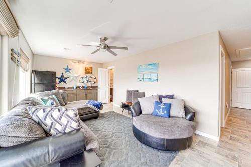 a living room with a couch and two chairs at Fire Pit and Stunning Views Lake Eufaula Retreat! in Texanna