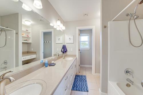 a white bathroom with two sinks and a tub at Fire Pit and Stunning Views Lake Eufaula Retreat! in Texanna