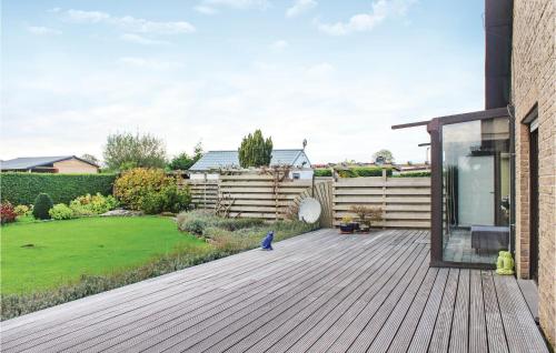 a deck with a bird sitting on top of it at 4 Bedroom Gorgeous Home In Groede in Groede