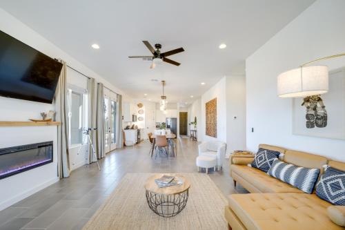 a living room with a couch and a tv at Hikers Retreat with Furnished Patio in Rimrock! in Rimrock