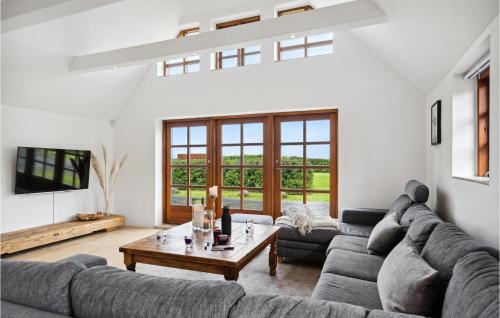 a living room with a couch and a table at Stunning Home In Otterup With Kitchen in Otterup