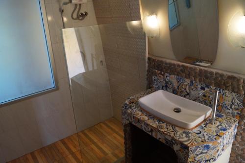 a bathroom with a sink and a shower at RELAX ECO Life Center-Khao Lak in Khao Lak