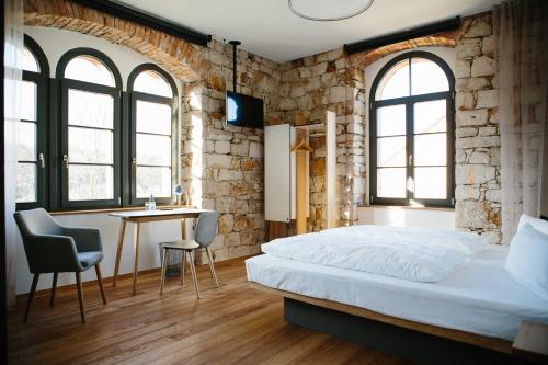 Postel nebo postele na pokoji v ubytování OX Hotel Altes Spital