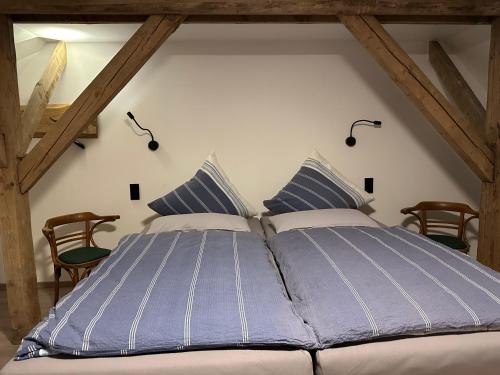 Una cama o camas en una habitación de Eiche - Ferienwohnung in Dötlingen mit Waldblick