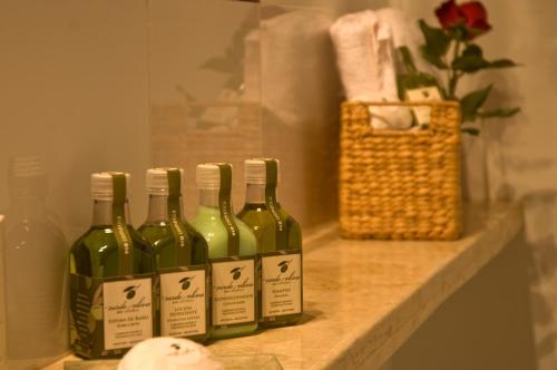 a group of four bottles of wine sitting on a counter at Posada Verde Oliva in Maipú