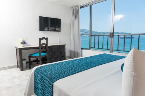 Ritz Acapulco All Inclusiveにあるテレビまたはエンターテインメントセンター