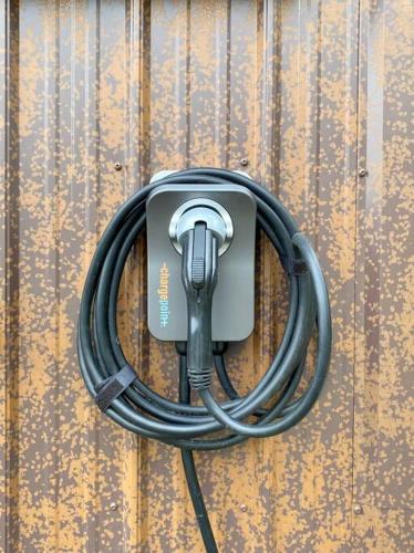 a hose is hooked up to a wooden wall at Inlet View Home in Homer