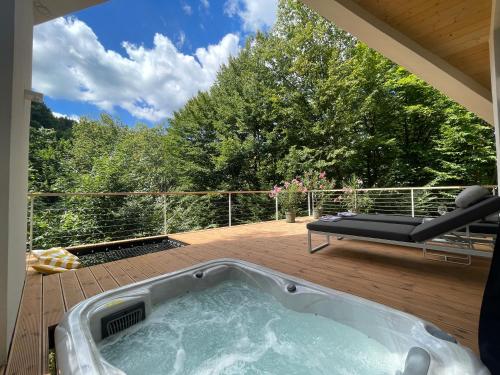a hot tub on the deck of a house at PEREM MiniVilla in Matrakeresztes