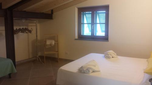 Ein Bett oder Betten in einem Zimmer der Unterkunft Di Luna e Di Sole