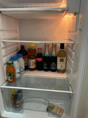 an open refrigerator filled with lots of condiments at Casa Castel in Civate