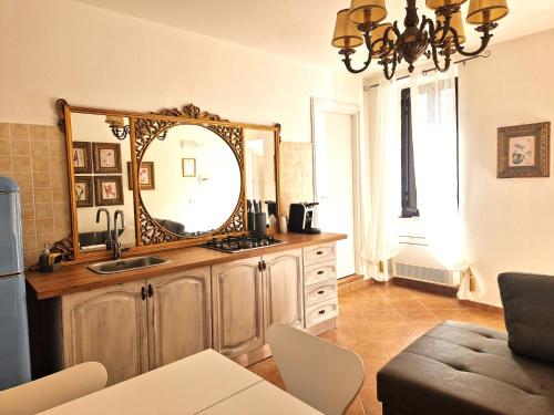 a bathroom with a sink and a mirror on a counter at La Corte dei Filangieri in Candida