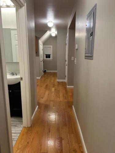 an empty hallway with a sink and a mirror at Convenient 2 bed Apt in Everett a Short Walk to Encore in Everett