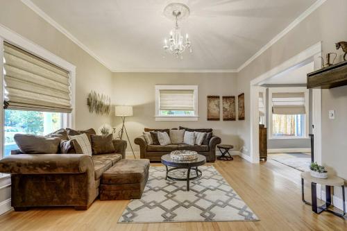 a living room with a couch and a table at Bristhol Bloom! Oasis in the Heart of COS! in Colorado Springs
