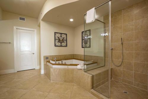 a large bathroom with a shower and a tub at Turquoise Place C2202 in Orange Beach