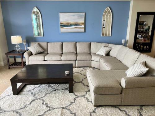 a living room with a couch and a coffee table at Turquoise Place C2202 in Orange Beach